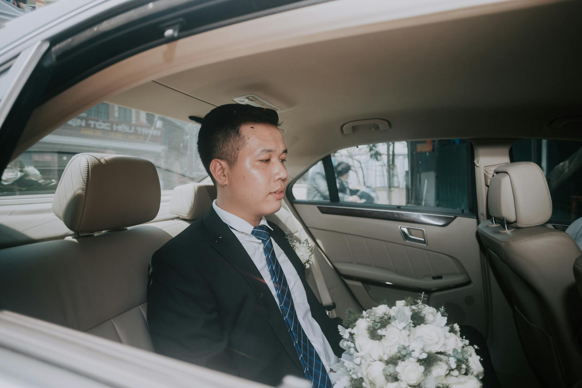 Chauffeur driving with bride